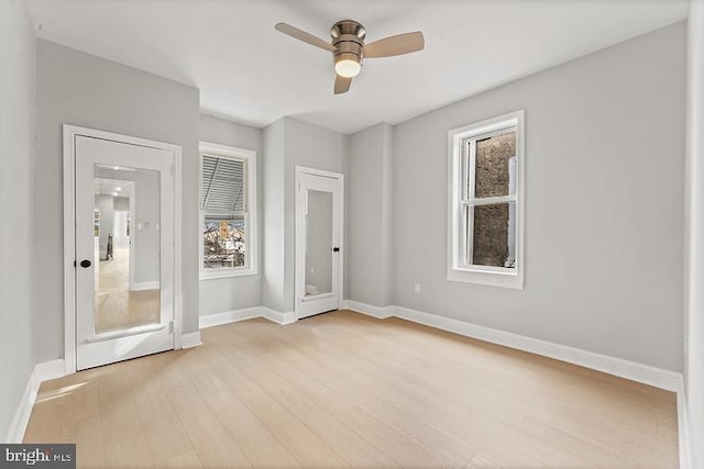 unfurnished room with ceiling fan and light hardwood / wood-style flooring