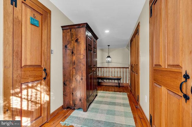 hall with light hardwood / wood-style flooring