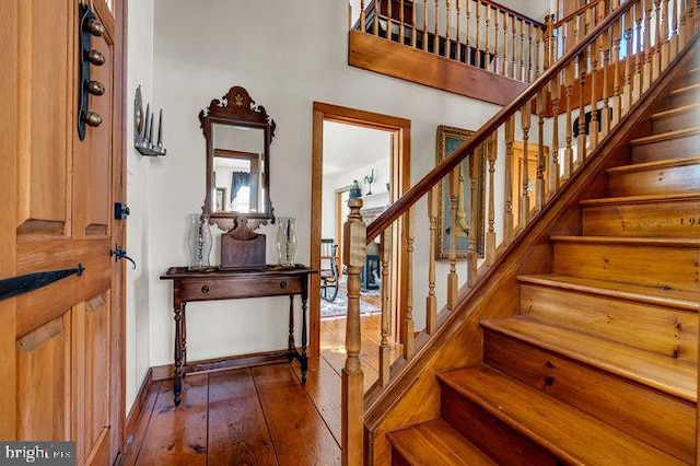 staircase featuring hardwood / wood-style flooring