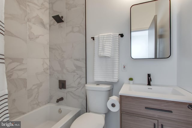 full bathroom with vanity, toilet, and tiled shower / bath combo