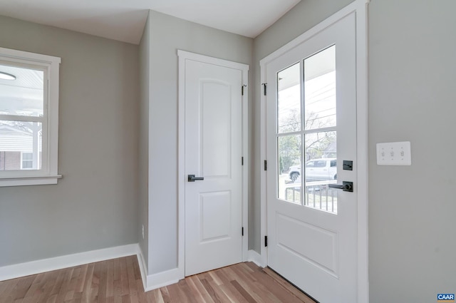 doorway to outside with light hardwood / wood-style floors