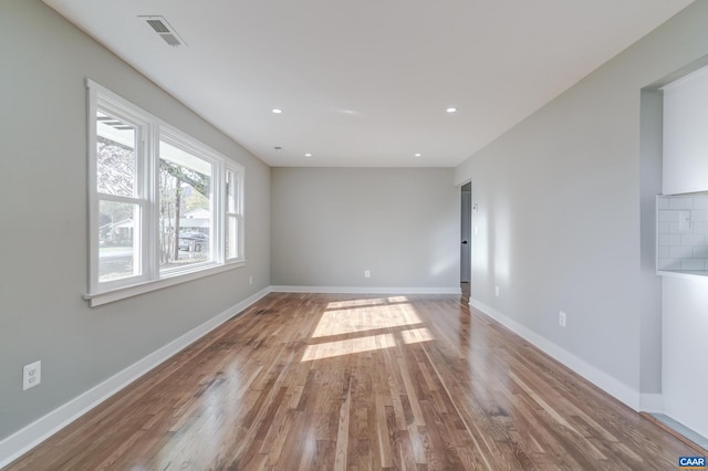 spare room featuring hardwood / wood-style floors