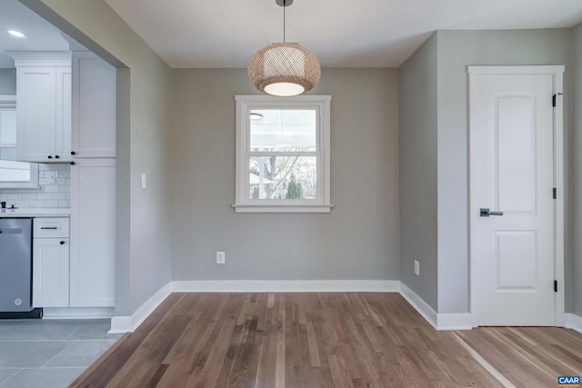 unfurnished dining area with light hardwood / wood-style flooring