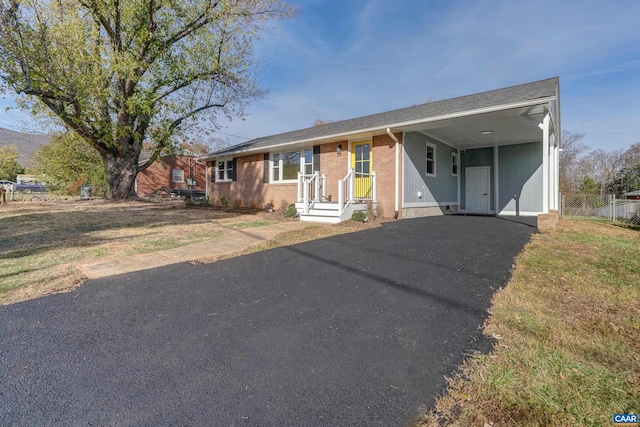 single story home with a carport