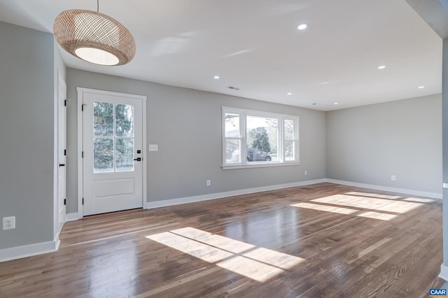 entryway with hardwood / wood-style flooring