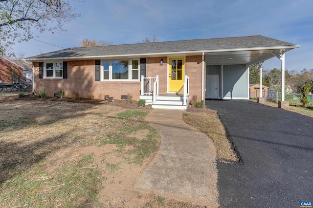 single story home featuring a carport