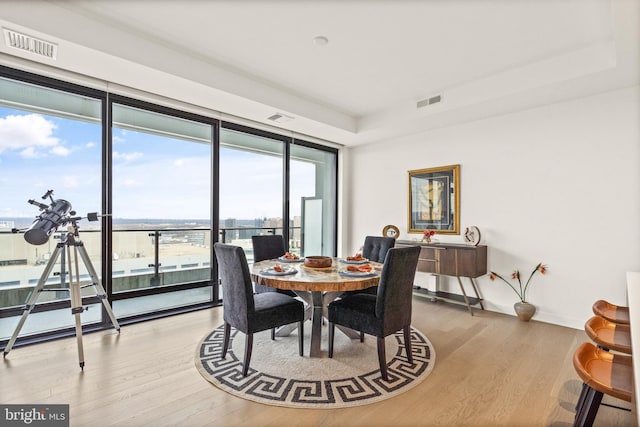 dining area featuring light wood-type flooring