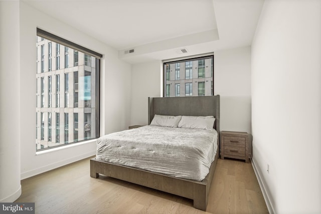 bedroom with light hardwood / wood-style flooring