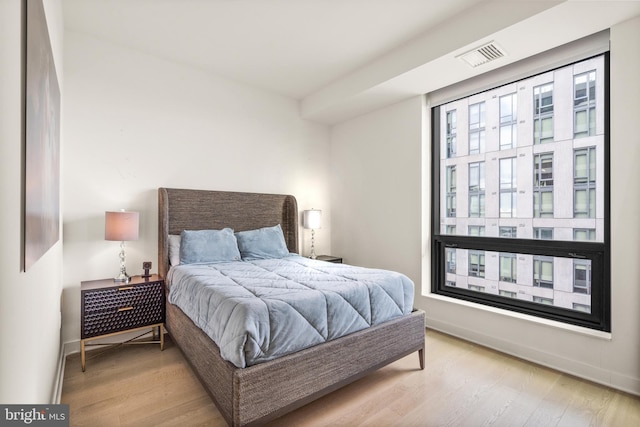 bedroom featuring light wood-type flooring