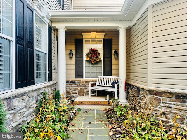 entrance to property featuring a porch