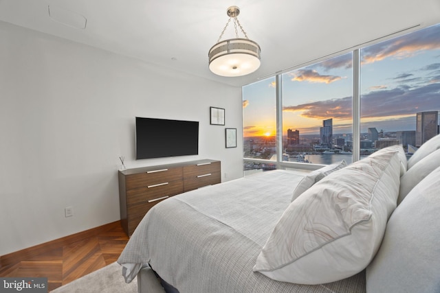 bedroom featuring parquet flooring