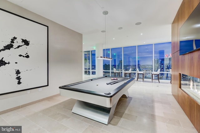 recreation room featuring expansive windows, light tile patterned floors, and pool table