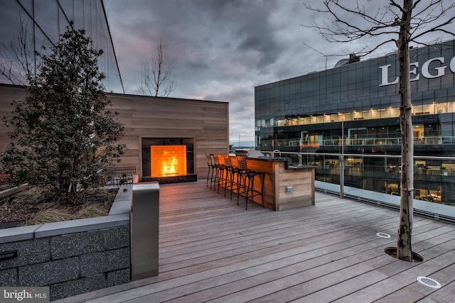 wooden terrace with a bar