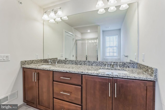 bathroom featuring vanity and walk in shower