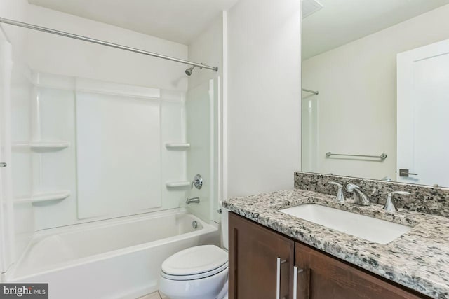 full bathroom featuring vanity, toilet, and washtub / shower combination