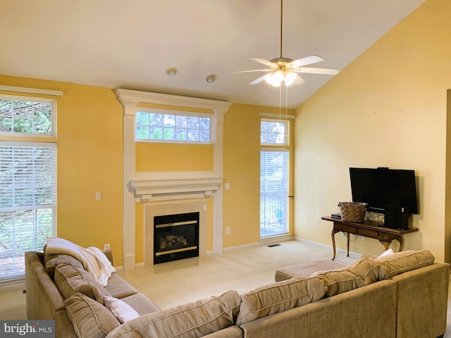 living room with ceiling fan, light colored carpet, a healthy amount of sunlight, and high vaulted ceiling