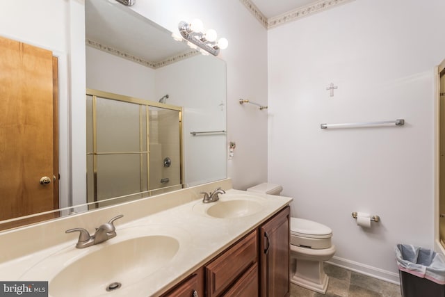 bathroom featuring vanity, toilet, and walk in shower