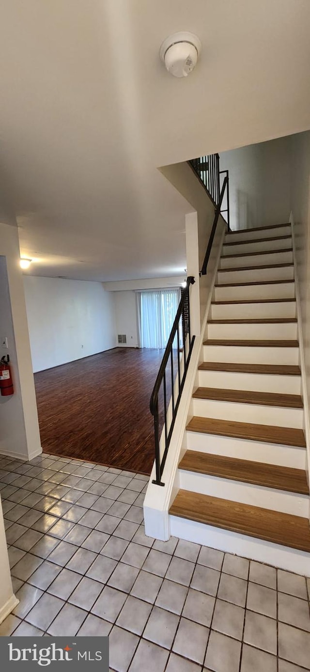 stairway with wood-type flooring