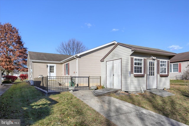 rear view of house with a yard