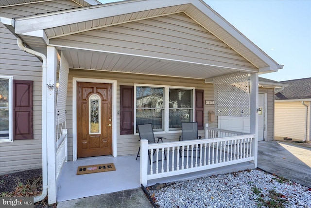 view of exterior entry featuring a porch