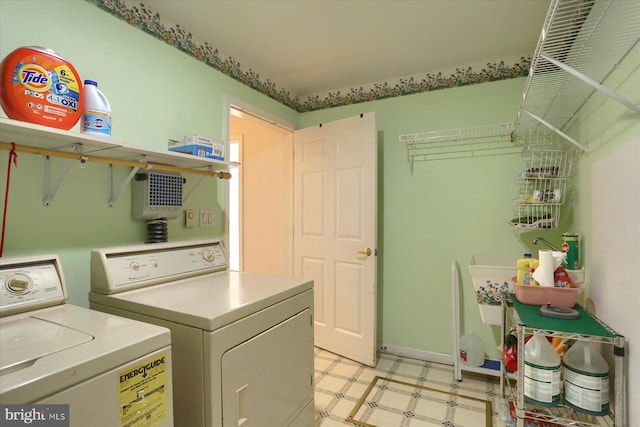 laundry room with washing machine and clothes dryer