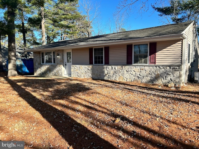 ranch-style home with cooling unit