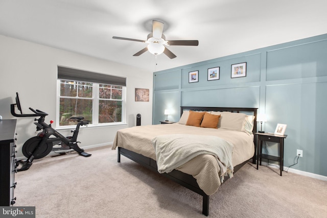 bedroom with ceiling fan and light carpet