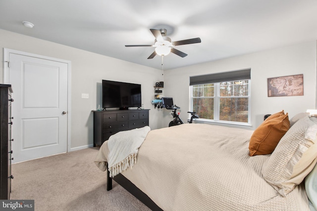 bedroom featuring ceiling fan and light colored carpet