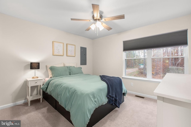 carpeted bedroom with electric panel and ceiling fan