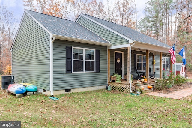 bungalow featuring a porch, central AC, and a front lawn