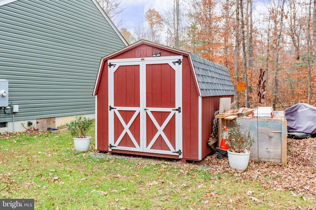 view of outbuilding featuring a yard