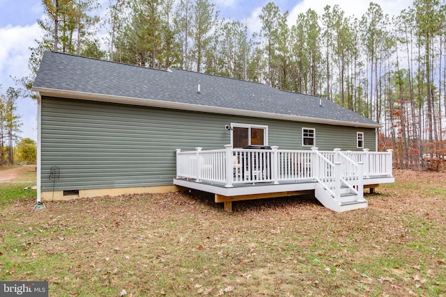 back of house with a wooden deck