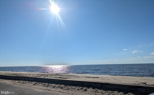 property view of water featuring a beach view