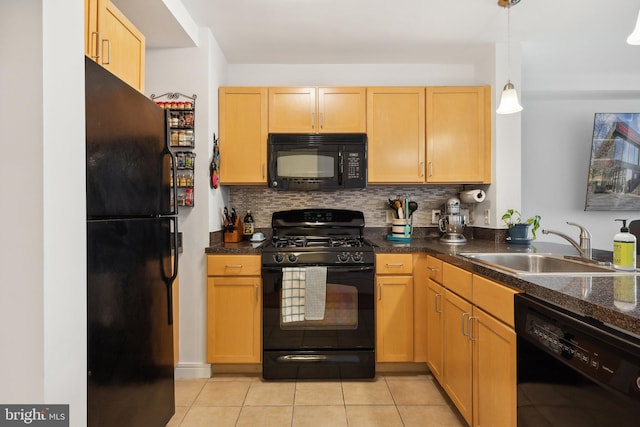 800 4th St SW Unit S312, Washington, DC 20024 - kitchen featuring black appliances, a sink, light tile patterned floors, decorative backsplash, and dark countertops