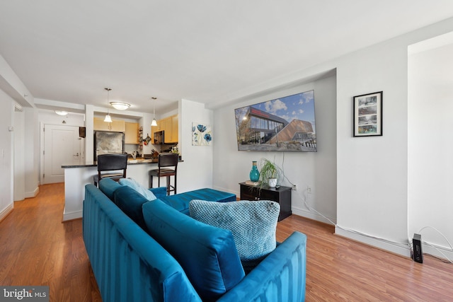 800 4th St SW Unit S312, Washington, DC 20024 - living area with light wood-style floors and baseboards