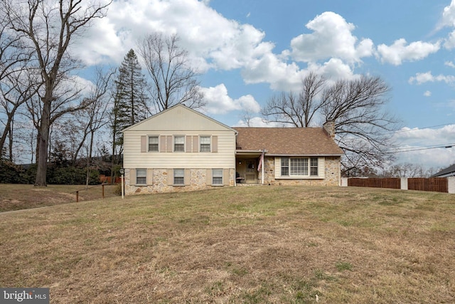 split level home with a front yard