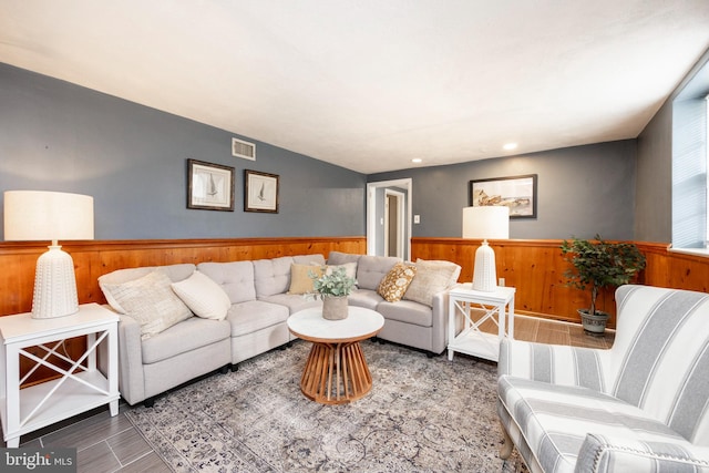 living room featuring wooden walls