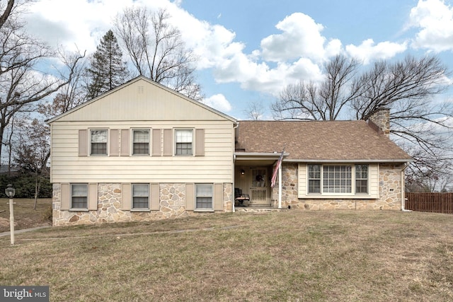 split level home with a front lawn