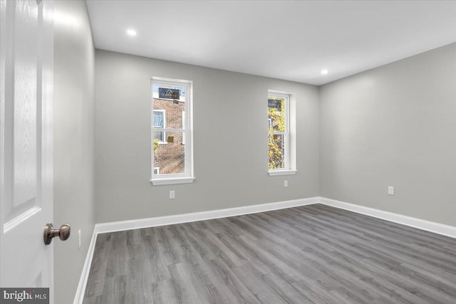 empty room with wood-type flooring