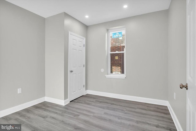 unfurnished room featuring light wood-type flooring