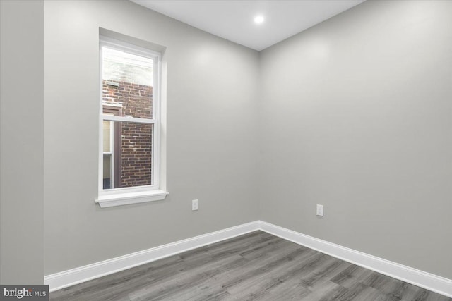 spare room featuring hardwood / wood-style floors