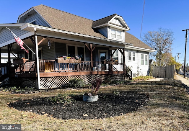 back of house featuring a porch