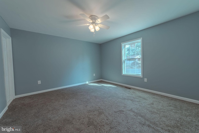 empty room with carpet and ceiling fan