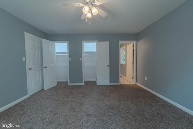 unfurnished bedroom with ceiling fan and light carpet