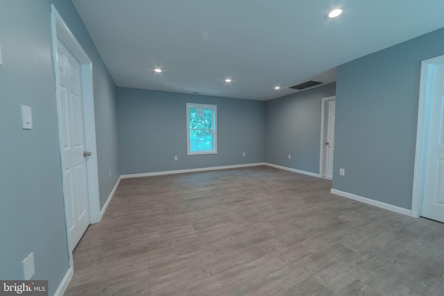 unfurnished room featuring light hardwood / wood-style floors