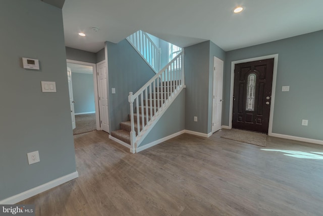 foyer entrance with light hardwood / wood-style flooring