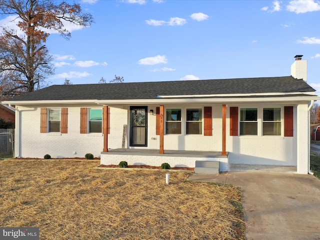 single story home featuring covered porch