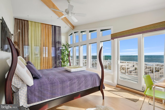 bedroom with ceiling fan, a beach view, light hardwood / wood-style flooring, lofted ceiling with beams, and a water view