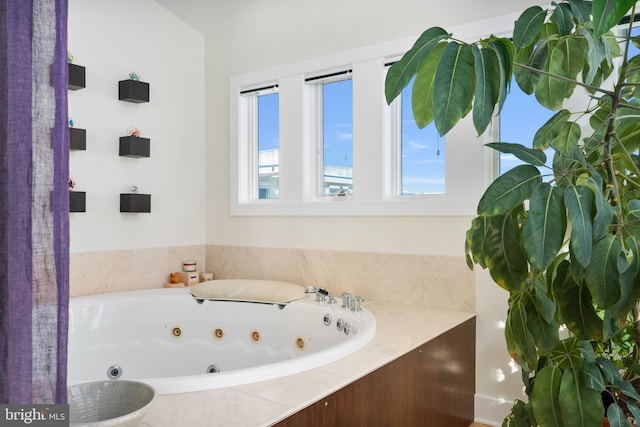 bathroom with tiled tub