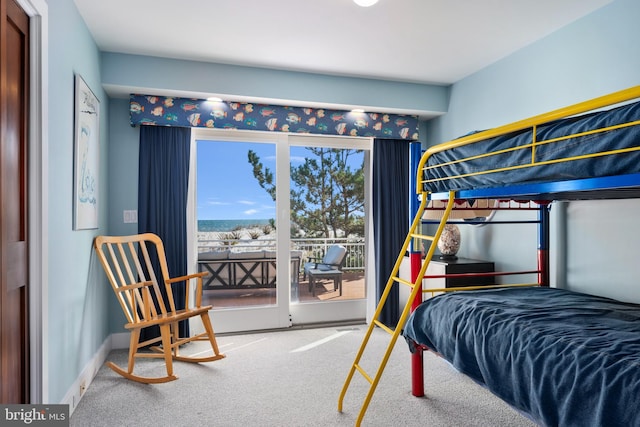 bedroom featuring carpet flooring and access to outside